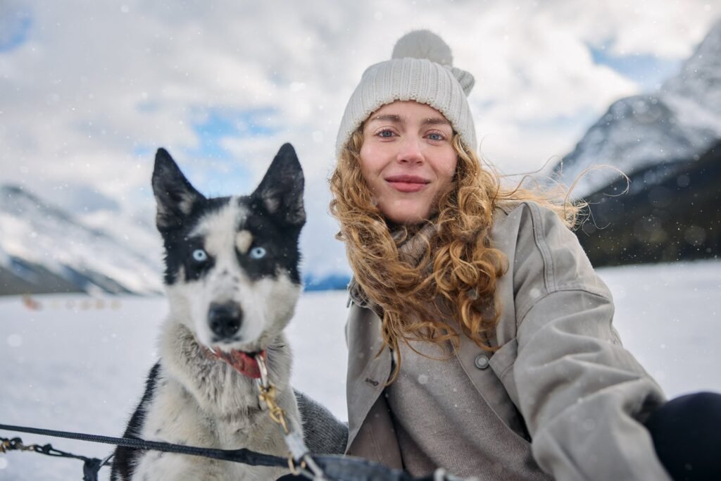 Woman and Dog Sledding – Travel Alberta C&B Advertising